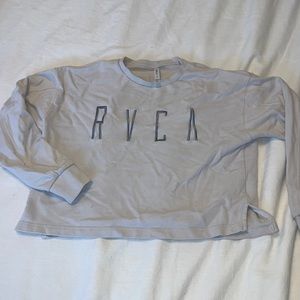 Cropped light pink/purple RVCA sweatshirt.